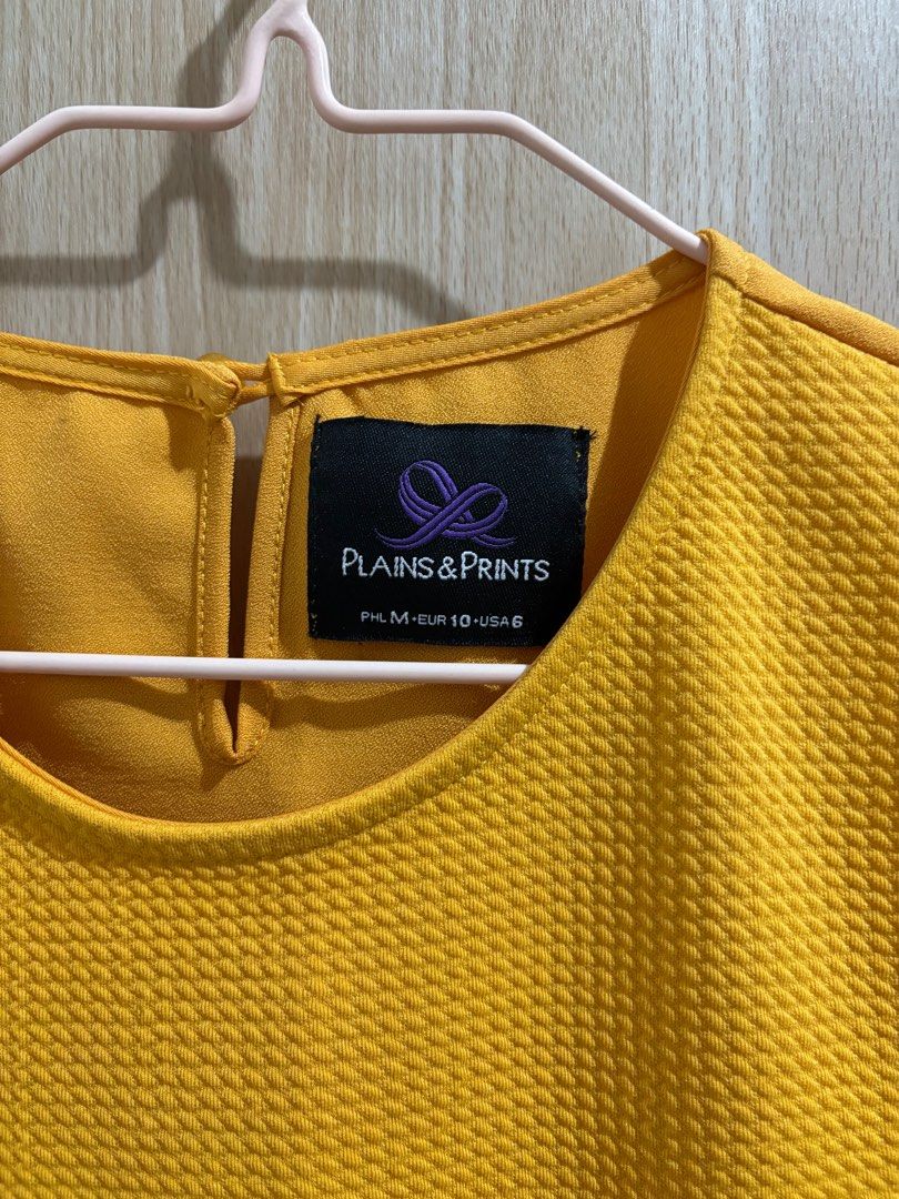 Plains & Prints Sleeveless Top (Category: Sleeveless) located in Balanga. Submitted by pmcgee (Listing ID 1400963912, Image 2). Description: - Plains & Prints sleeveless top - Mustard yellow color - Textured front panel - Contrasting smooth side panel - Keyhole back closure - Size: PHL M, EUR 10, USA 6.