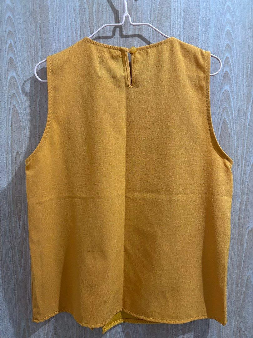 Plains & Prints Sleeveless Top (Category: Sleeveless) located in Balanga. Submitted by pmcgee (Listing ID 1400963912, Image 3). Description: - Plains & Prints sleeveless top - Mustard yellow color - Textured front panel - Contrasting smooth side panel - Keyhole back closure - Size: PHL M, EUR 10, USA 6.