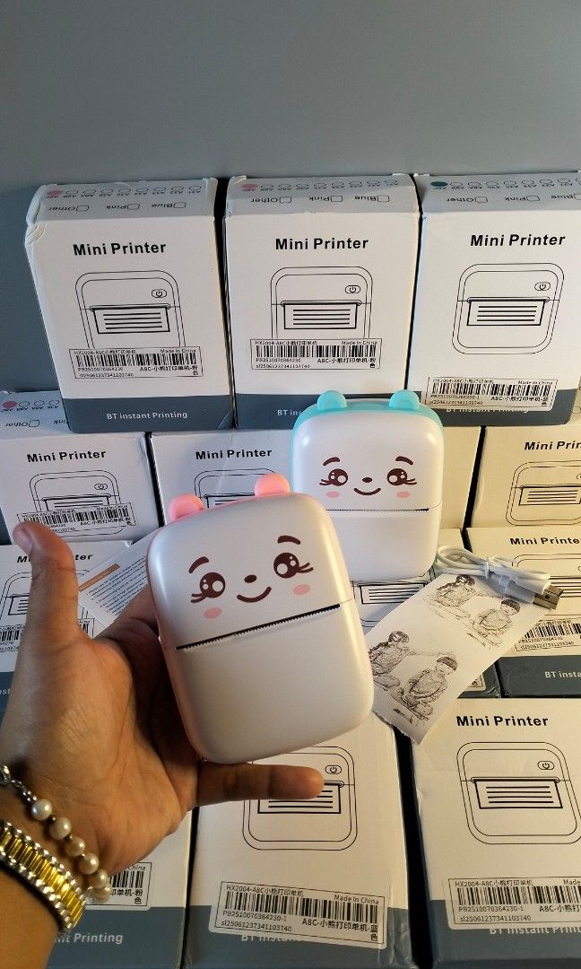 Portable Mini Printer (Category: Printers, Scanners & Copiers) located in Manila. Submitted by alayassulittipidfinds (Listing ID 1400790963, Image 3). Description: - Portable mini photo printer - Prints black and white images - Includes a roll of paper - Easy to use and compact - Cute design, ideal for travel - Comes with the original box.