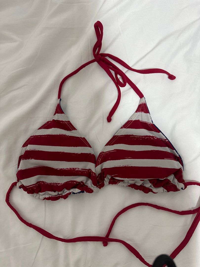 Reversible American Flag Bikini Top (Category: Bikinis & Swimsuits) located in Manila. Submitted by mingmingtsu_ (Listing ID 1400888495, Image 2). Description: - Reversible bikini top - Features American flag design on one side - Red and white stripes on the other side - Triangle style - Red straps - Tie closure at the neck - Made of lightweight fabric.