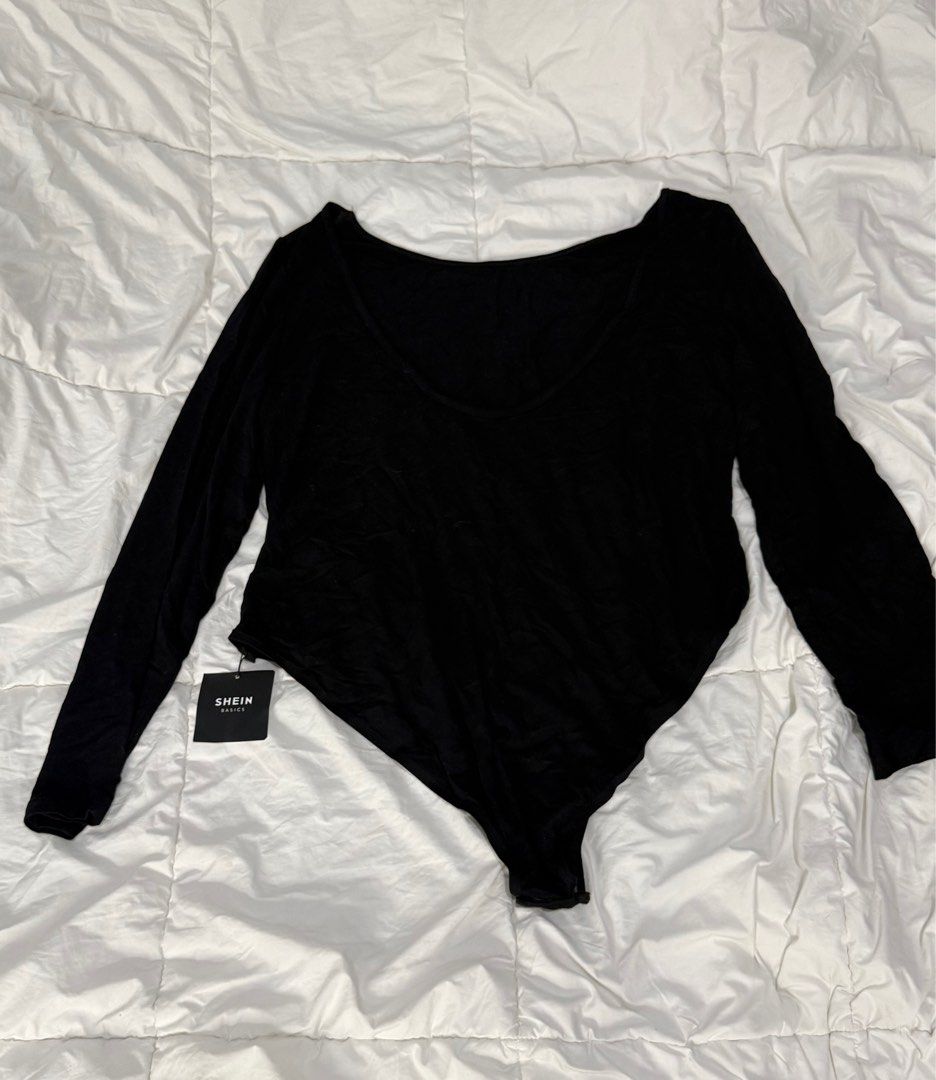 Shein Black Long Sleeve Bodysuit (Category: Others Tops) located in Quezon City. Submitted by anjvb (Listing ID 1400787175, Image 1). Description: SHEIN Curve Longsleeve bodysuit 4XL - Brand new with tag - Shein black long-sleeved bodysuit - Features a flattering deep V-neck - Made of soft, stretchy material - Brand new with tag attached - Great for layering or wearing alone - A versatile addition to your wardrobe.