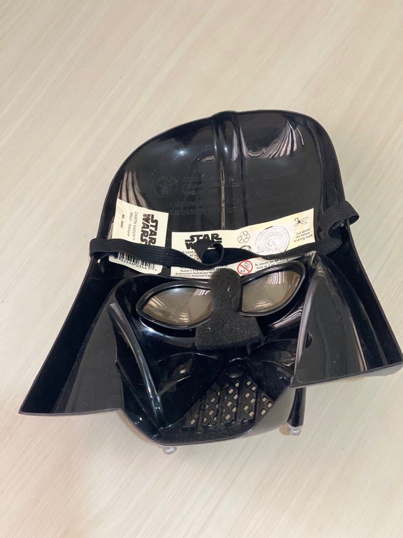 Star Wars Darth Vader Mask (Category: Western Merchandise) located in Makati City. Submitted by esila.essentials (Listing ID 1400965901, Image 3). Description: - Authentic Darth Vader mask - Iconic black design with breathing apparatus - Includes elastic strap for secure wear - Made of durable plastic - Perfect for cosplay or display - Licensed Star Wars product This is a Darth Vader mask. It is a costume accessory based on the character from the