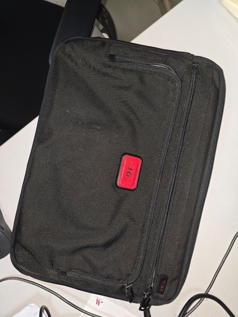 TUMI Laptop Bag Sleeve Fits 15" (Category: Laptop Bags & Sleeves) located in Pasig City. Submitted by clothesandthings_ (Listing ID 1400847763, Image 1). Description: initials can be replaced in Tumi store (for a fee).