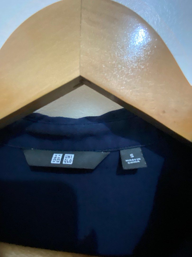 Uniqlo Navy Blouse - Size S (Category: Blouses) located in Manila. Submitted by zapitup (Listing ID 1400893248, Image 2). Description: - Uniqlo navy blue blouse - Size: Small - Features: Collared neckline, long sleeves - Made in China - Versatile design - Suitable for various occasions.
