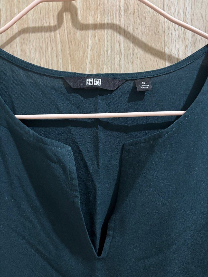 Uniqlo Sleeveless Top Medium (Category: Sleeveless) located in Balanga. Submitted by pmcgee (Listing ID 1400964005, Image 2). Description: - Uniqlo sleeveless top - Size: M - Color: Dark Teal - Design: V-neck - Fabric: Smooth, likely synthetic - Style: Simple, classic - Condition: Good as new.