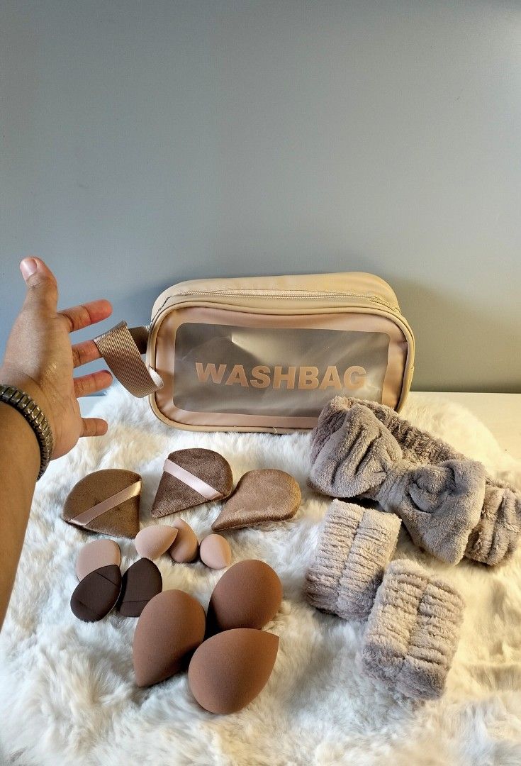 Washbag Makeup Set with Sponges and Headbands (Category: Makeup) located in Manila. Submitted by alayassulittipidfinds (Listing ID 1400790174, Image 1). Description: Makeup set includes a washbag, makeup sponges, and headbands. The washbag has a clear front panel and a handle. The set also contains various shapes and sizes of makeup sponges and matching headbands. Available in pink and purple color options. Perfect for storing and applying makeup
