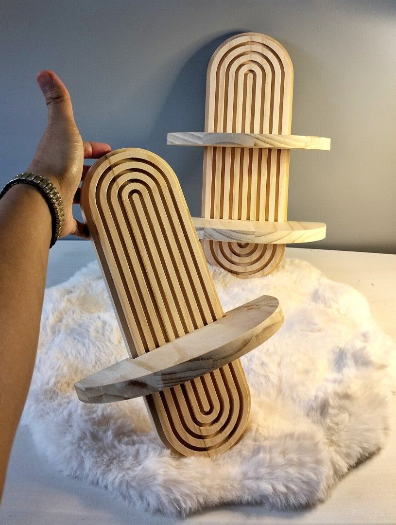 Wooden Wall Shelf (Category: Shelves, Cabinets & Racks) located in Manila. Submitted by alayassulittipidfinds (Listing ID 1400792124, Image 1). Description: Beautiful wooden wall shelf with a unique arched design. Features two shelves for displaying items. Made of light-colored wood. Perfect for adding a touch of natural elegance to any room. The design is both functional and decorative, suitable for various decor styles..