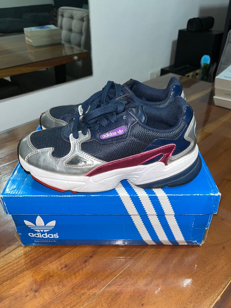 Adidas Falcon W CG6213 Navy Silver (Category: Sneakers) located in Caloocan City. Submitted by jcorpuz1 (Listing ID 1401082274, Image 1). Description: - Size is US 7.5, UK 6, and EUR 39.5 - With original box - Has few cracks on silver part on the sides (can be seen in the pictures) .