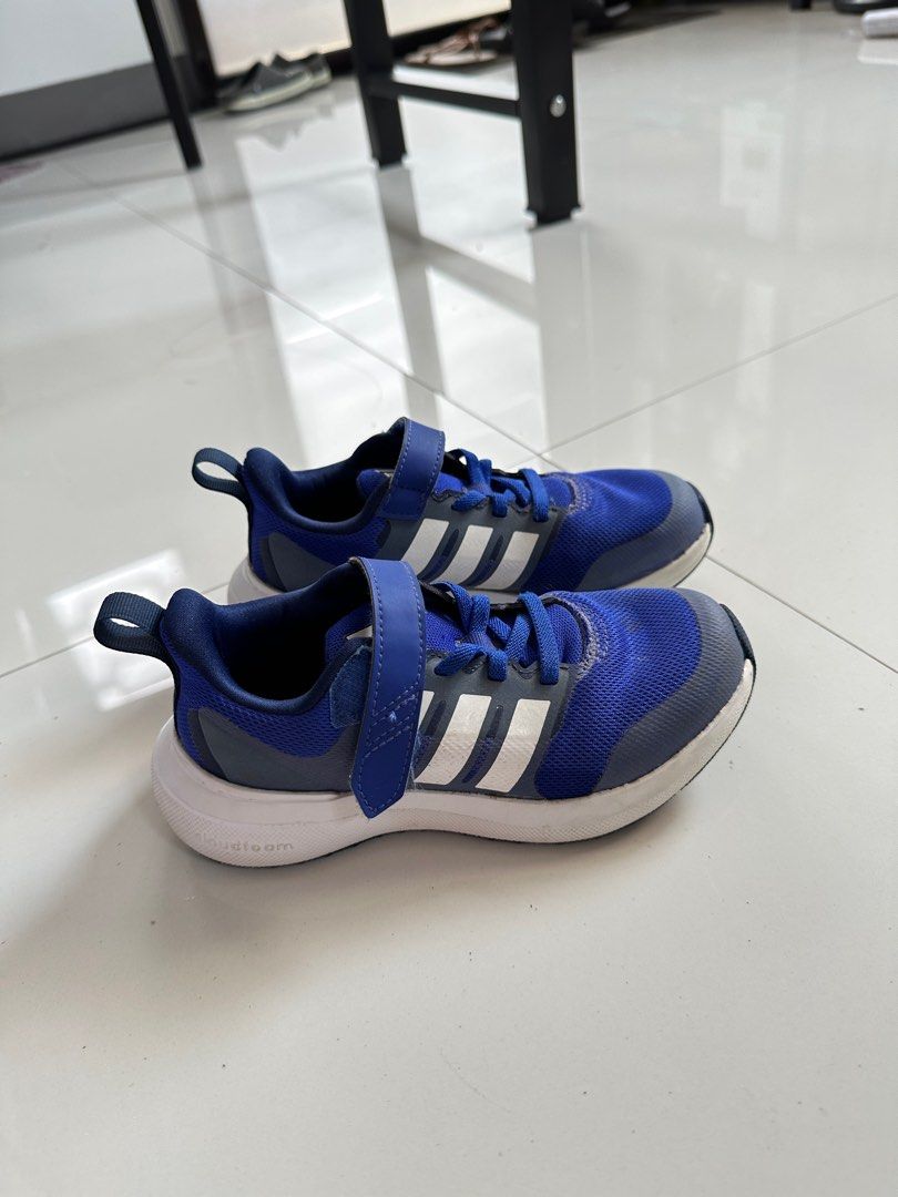 Adidas Kids' Running Shoes (Category: Babies & Kids Fashion) located in Amadeo. Submitted by mafpl (Listing ID 1401018399, Image 2). Description: Size: US 11.5 / UK 11 - Adidas kids' running shoes - Color: Blue and white - Easy on/off with hook-and-loop strap - Breathable mesh upper - Durable white sole - Adidas logo detail.