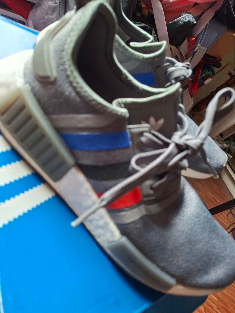 Adidas NMD R1 Grey Sneakers (Category: Sneakers) located in Rizal. Submitted by silverposh (Listing ID 1401026280, Image 2). Description: - Adidas NMD R1 sneakers - Color: Grey with red and blue stripes - White sole - Grey laces - Size:men- US 7 / UK 6 / EU 40 / JP 250 size 8.5 for women - Includes original box used lije 2-3x only.