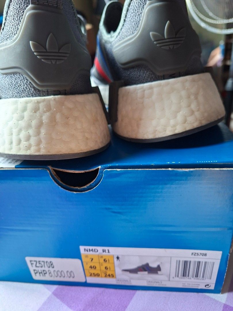 Adidas NMD R1 Grey Sneakers (Category: Sneakers) located in Rizal. Submitted by silverposh (Listing ID 1401026280, Image 3). Description: - Adidas NMD R1 sneakers - Color: Grey with red and blue stripes - White sole - Grey laces - Size:men- US 7 / UK 6 / EU 40 / JP 250 size 8.5 for women - Includes original box used lije 2-3x only.