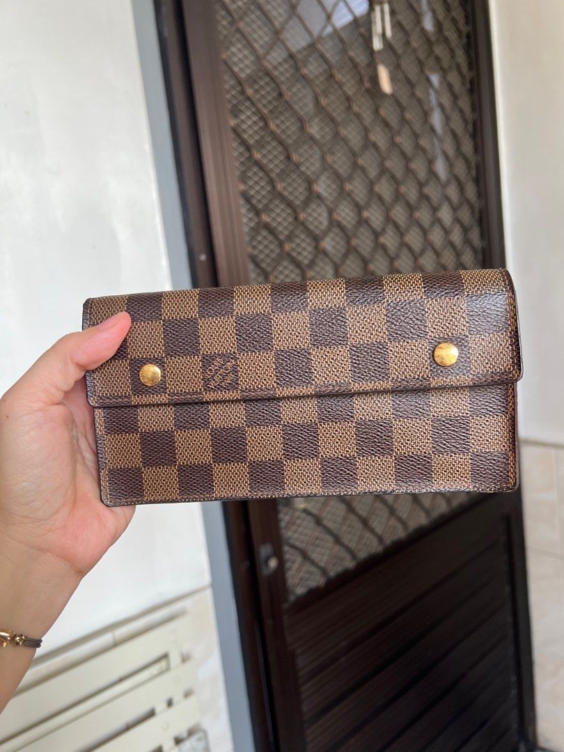 Authentic Louis Vuitton Damier Accordion Ebene Wallet (Category: Luxury Bags & Wallets) located in Caloocan City. Submitted by alavishglam (Listing ID 1401109825, Image 1). Description: - Authentic Louis Vuitton Damier Ebene wallet - Classic Damier Ebene check pattern - Gold-tone hardware - Long wallet style - Interior with multiple card slots - Zippered compartment - Snap closure - Brown interior lining.