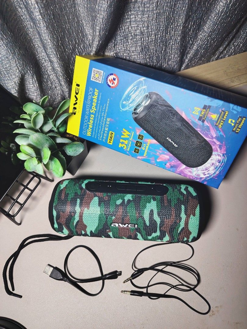AWEI Y669 Outdoor Waterproof Wireless Speaker (Category: Soundbars, Speakers & Amplifiers) located in Rizal. Submitted by serrahj (Listing ID 1401100950, Image 3). Description: AWEI Y669 outdoor waterproof wireless speaker. It has 31W output power and supports TWS. It is IPX7 waterproof and can play music for up to 12 hours. The speaker has a camouflage design. Includes the original box and charging cables..