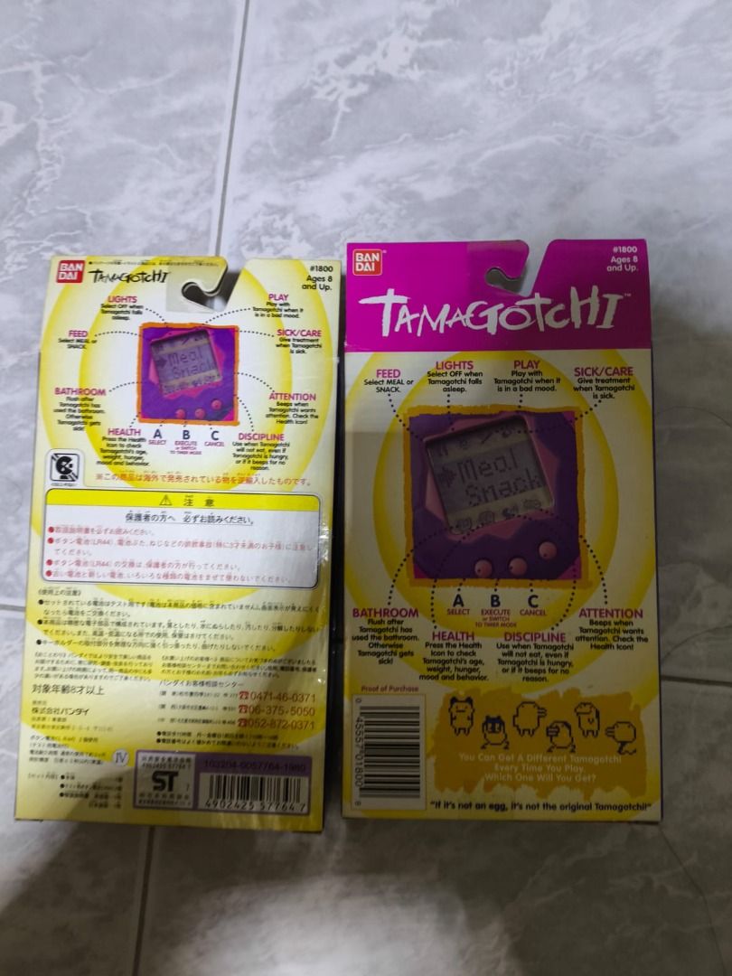 Bandai Tamagotchi - Original Virtual Pet 1997 edition (Opened to remove battery - Tested working) (Category: Interactive Toys) located in Singapore. Submitted by punyme (Listing ID 1385376084, Image 3). Description: *Green sold out** - Original Bandai Tamagotchi, new in box (only taken out to test and remove battery) - Available in multiple colours (please refer to pictures) - Includes original packaging and instructions - Some minor stains to ou