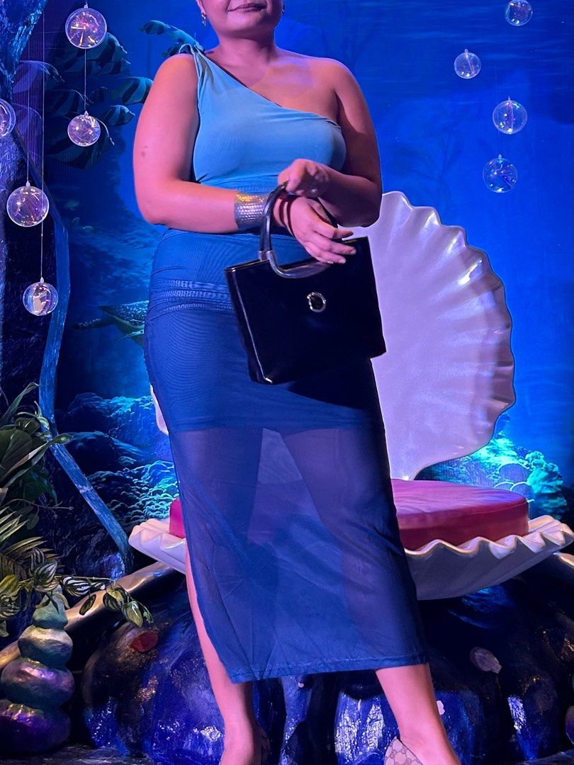 Blue Ombre One-Shoulder Maxi Dress (Category: Dresses) located in Muntinlupa City. Submitted by declutterwithksgs (Listing ID 1401163866, Image 2). Description: Used twice only for events, otherwise, good as new condition. Size: Large Bought in Shein - Elegant ombre maxi dress - One-shoulder design - Fitted silhouette - Sheer skirt overlay - Vibrant blue color - Perfect for special occasions - Made of stretchy material.