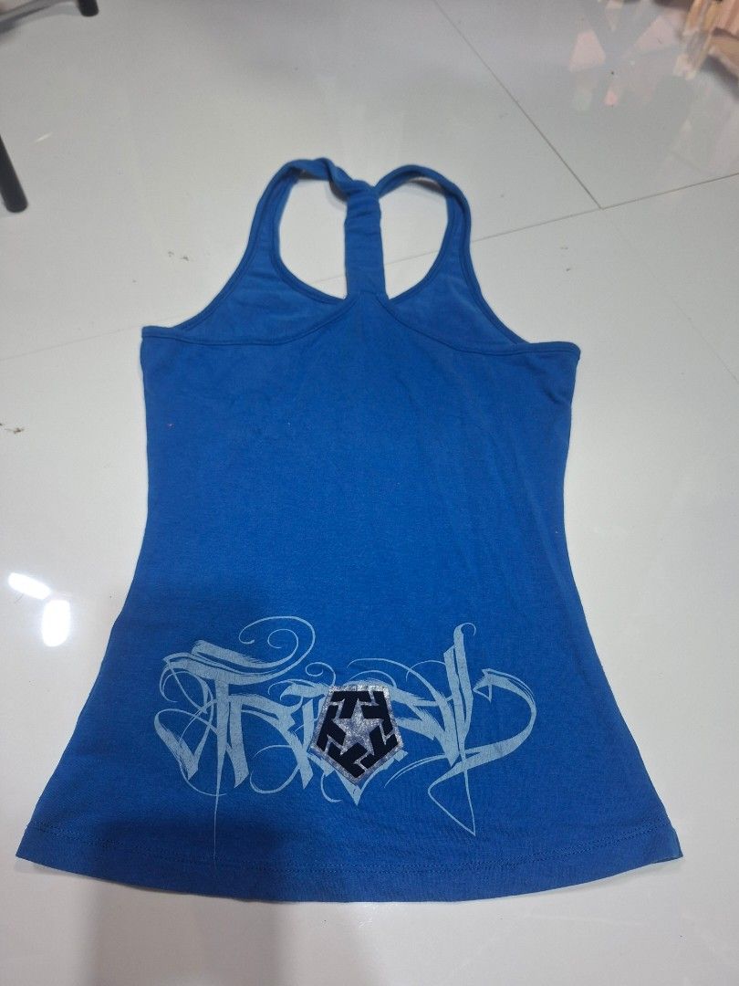 Blue Tank Top with Graphic Print (Category: Sleeveless) located in Rizal. Submitted by midsummer978190 (Listing ID 1400993186, Image 2). Description: size: xs- small fab: cotton mop: gcash mod: J&T/ Tiktok.