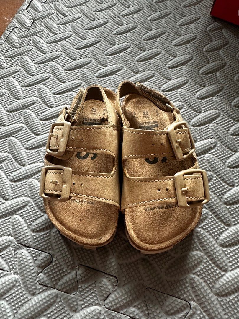 Cotton On Kids Sandals (Category: Babies & Kids Fashion) located in Cavite. Submitted by laarnibear (Listing ID 1401077522, Image 1). Description: PLEASE READ DESCRIPTION BEFORE CHATTING: Cotton On Kids sandals, Tan color, Size 7 (good for 12-13 cm foot of toddler). Two adjustable buckle straps, Cork footbed, Ridged sole. No issues, Rfs: baby outgrown the size. How to get the items: 1. Anytime: Buyer may book lalamove or grab to pick up in Silang