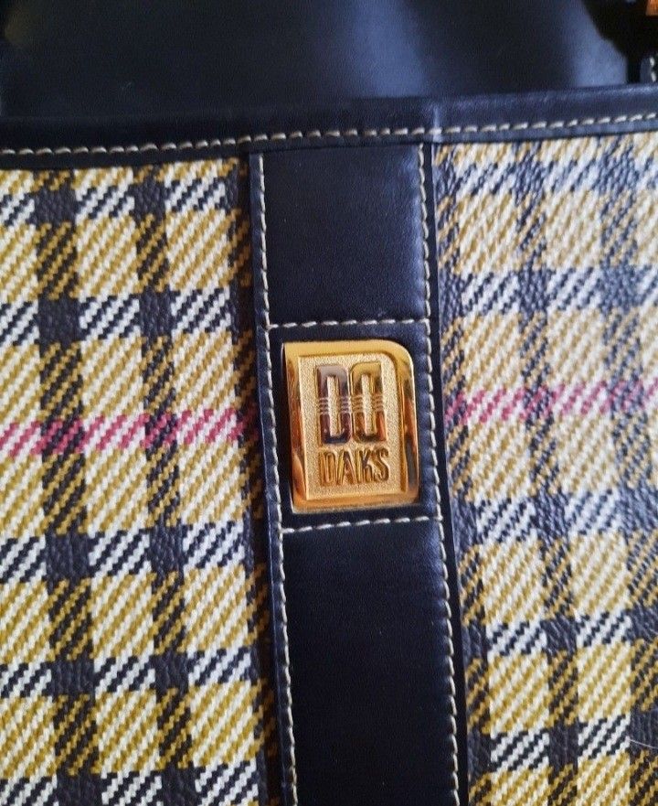 DAKS Plaid Handbag (Category: Luxury Bags & Wallets) located in Manila. Submitted by johnchel (Listing ID 1401018162, Image 2). Description: - Classic DAKS handbag - Features a timeless plaid pattern - Accented with black leather (handles, base) - Gold-toned DAKS logo - Sturdy construction and handles - Practical size for daily use.