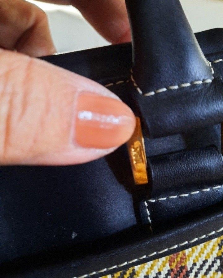 DAKS Plaid Handbag (Category: Luxury Bags & Wallets) located in Manila. Submitted by johnchel (Listing ID 1401018162, Image 3). Description: - Classic DAKS handbag - Features a timeless plaid pattern - Accented with black leather (handles, base) - Gold-toned DAKS logo - Sturdy construction and handles - Practical size for daily use.