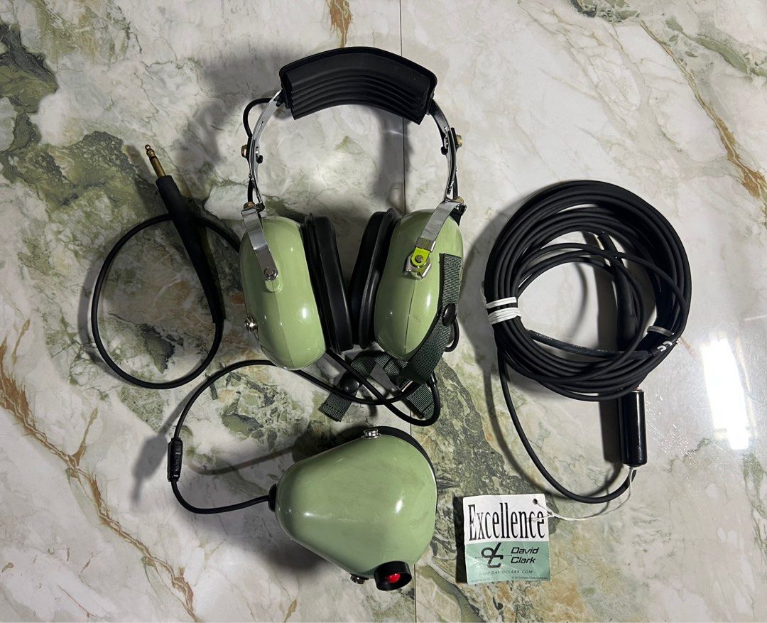 David Clark - H3310 Aviation Headset (Category: Headphones & Headsets) located in Subic. Submitted by thrifters_23 (Listing ID 1401018229, Image 1). Description: Check out this David Clark H3310 Aviation Headset! This headset is built to last, with a sturdy design and comfortable earcups. The color is a classic aviation green, and it comes with all the necessary cables. Perfect for pilots or aviation enthusiasts! If you're looking for a reliable 