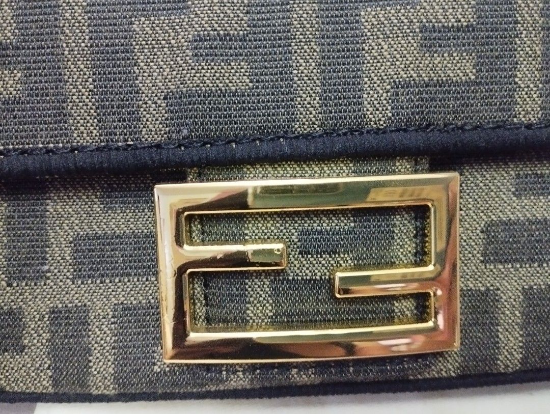 Fendi Baguette Bag (Category: Luxury Bags & Wallets) located in Manila. Submitted by scherielar31543 (Listing ID 1400980110, Image 3). Description: Fendi Baguette bag - Features the iconic FF logo pattern - Detachable gold chain strap and wrist strap included - Gold-tone buckle closure - Fabric lined interior with Fendi label - Includes dust bag Free shipping.