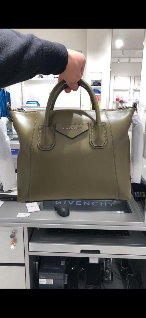 Givenchy Antigona Small Handbag (Category: Luxury Bags & Wallets) located in Caloocan City. Submitted by usforless (Listing ID 1401111621, Image 1). Description: - Givenchy Soft Antigona Small handbag - Color: Olive Green - bought Jan 2024 for ₱78,000 Features: - Top handles - Detachable shoulder strap - Zipper closure - Material: Leather - Givenchy logo on front RFS: Not using anymore.