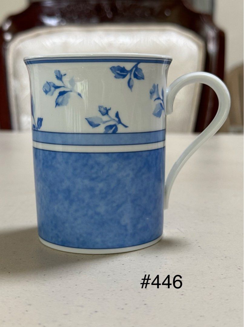 Hutschenreuther Summerdream Blue Mug (Category: Coffee & Tea Tableware) located in Quezon City. Submitted by meggoquingco (Listing ID 1401049893, Image 1). Description: Hutschenreuther mug from the Summerdream Blue collection. It is made in Germany. The mug has a white base with a handle. The bottom of the mug features the brand name, collection name, and the country of origin. The mug has a simple, elegant design..
