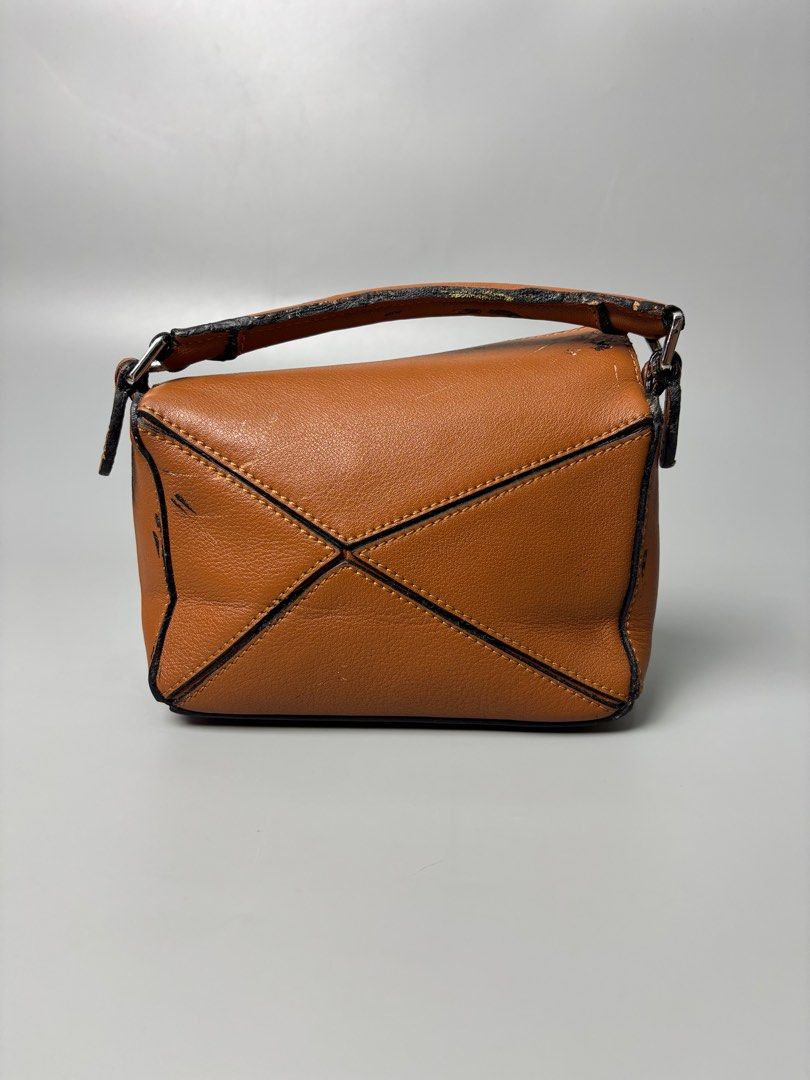 Loewe Puzzle Mini Bag (Category: Luxury Bags & Wallets) located in Quezon City. Submitted by lucky.purelux.ph (Listing ID 1401005616, Image 3). Description: Loewe Mini Puzzle Leather Bag Free shipping within Metro Manila Additional shipping charges for provincial deliveries Please read the description before buying MOP: gcash, bank transfer (bpi) Courier: J&T, lalamove Please view all uploaded photos before purchase you can also ask questions abo