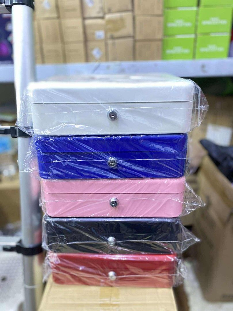 Metal Cash Box with Lock (Category: Storage Boxes & Baskets) located in Manila. Submitted by yzlshop (Listing ID 1401030276, Image 1). Description: - Available in white, blue, pink, black, and red. - Brand new and still in plastic wrap. - Features a secure lock. - Ideal for cash, small valuables, and important documents. - Provides a practical and secure storage solution..