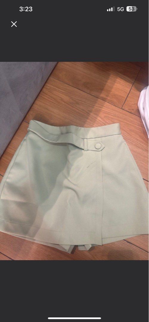 Mint Green Skort (Category: Skirts) located in Quezon City. Submitted by wantstodeclutter (Listing ID 1401046269, Image 1). Description: - Mint green skort - Button detail - Belt loop - Lightweight fabric - Versatile for casual or dressed-up looks.
