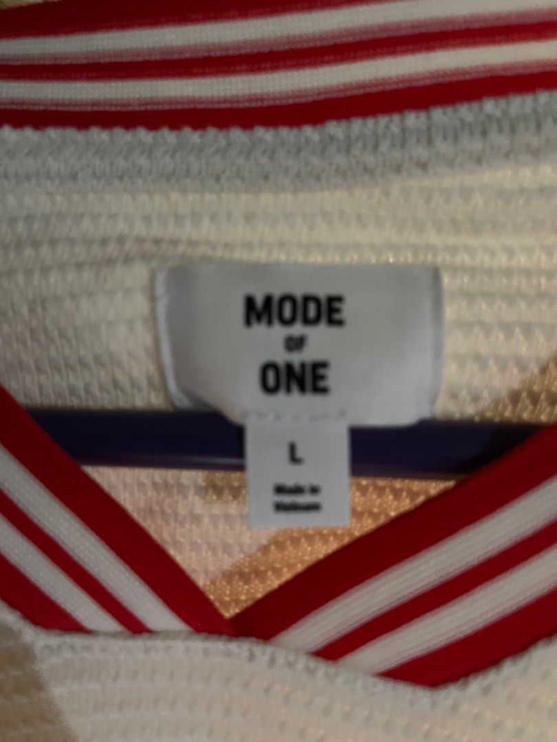 Mode of One La Brea Jersey (Category: Tshirts & Polo Shirts ) located in Obando. Submitted by Wintermelonzzzz (Listing ID 1401039071, Image 3). Description: Mode of One La Brea jersey. Features a white base with red accents on the collar and sleeves. The front displays "LA BREA CALIFORNIA" in bold black lettering, with "LA" on the upper left. A circular graphic with a palm tree and the words "GOING NOWHERE FAST" is on the right side. Made in Viet