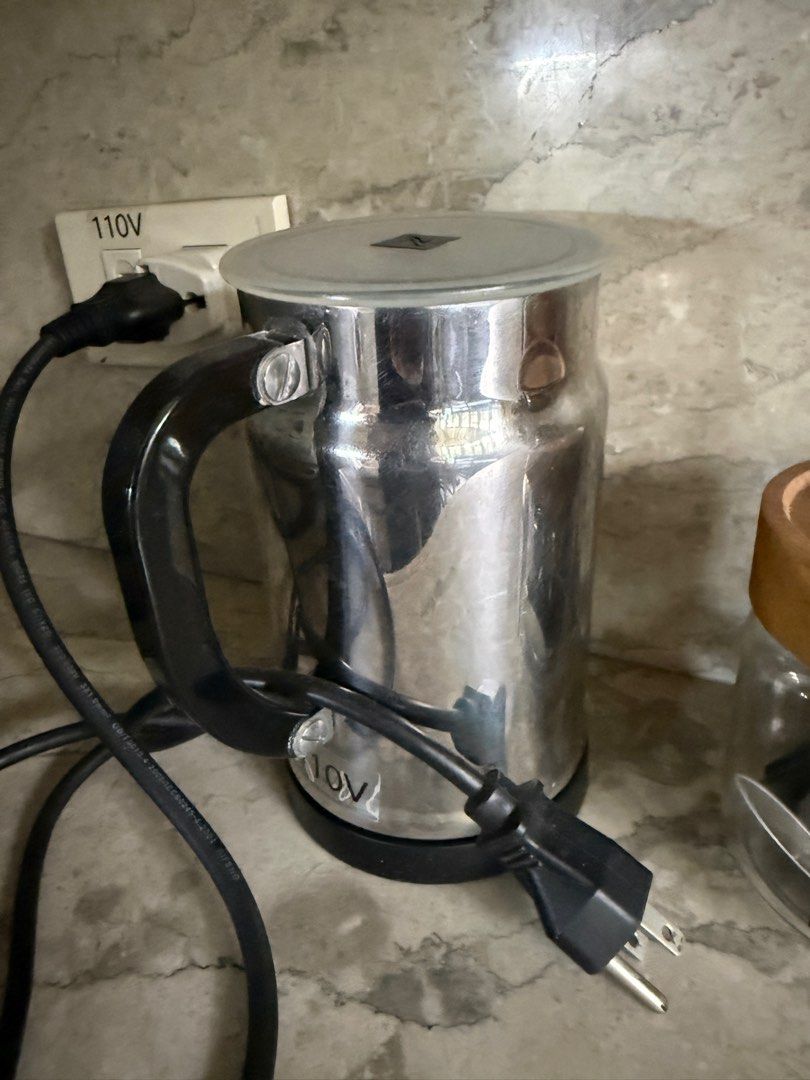Nespresso Coffe Machine + Frother (Category: Coffee Machines & Makers) located in Quezon City. Submitted by declutter1ngmama (Listing ID 1401161792, Image 3). Description: Includes Nespresso machine (still in good condition but has been with me for 10years now) Frother - 110v, needs to be fixed (as I accidentally plugged in 220v) Nespresso pods - pods only . Containers not part of bundle .