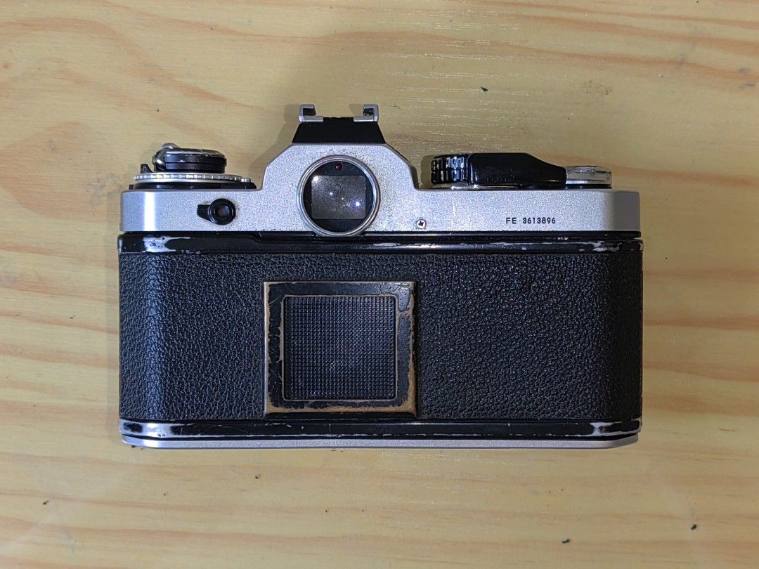 Nikon FE 35mm Film Camera (Category: Cameras) located in Pasay City. Submitted by garage_sale.phil (Listing ID 1400995631, Image 3). Description: Nikon Fe Silver Film advance lever - working Shutter curtain - working M90 manual shutter speed and bulb mode - working Actual photos posted. Issue: no battery, untested. Selling as is. Needs to be clad Price: Php. 3,000.