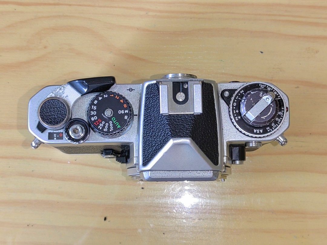 Nikon FE 35mm Film Camera (Category: Cameras) located in Pasay City. Submitted by garage_sale.phil (Listing ID 1400995631, Image 2). Description: Nikon Fe Silver Film advance lever - working Shutter curtain - working M90 manual shutter speed and bulb mode - working Actual photos posted. Issue: no battery, untested. Selling as is. Needs to be clad Price: Php. 3,000.