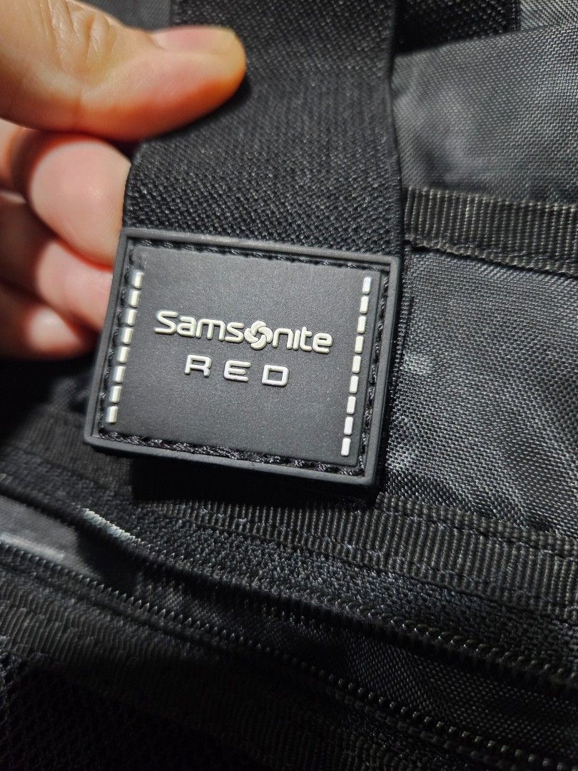 Samsonite Red Backpack M (Category: Backpacks) located in Iloilo. Submitted by floresse (Listing ID 1401112573, Image 2). Description: - Samsonite red backpack - Multiple compartments - Front pockets - Interior zippered pockets - Adjustable shoulder straps - Top handle - Made of polyester - Zipper pull on main compartment shows wear.