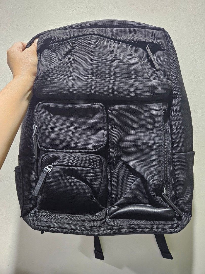 Samsonite Red Backpack M (Category: Backpacks) located in Iloilo. Submitted by floresse (Listing ID 1401112573, Image 1). Description: - Samsonite red backpack - Multiple compartments - Front pockets - Interior zippered pockets - Adjustable shoulder straps - Top handle - Made of polyester - Zipper pull on main compartment shows wear.