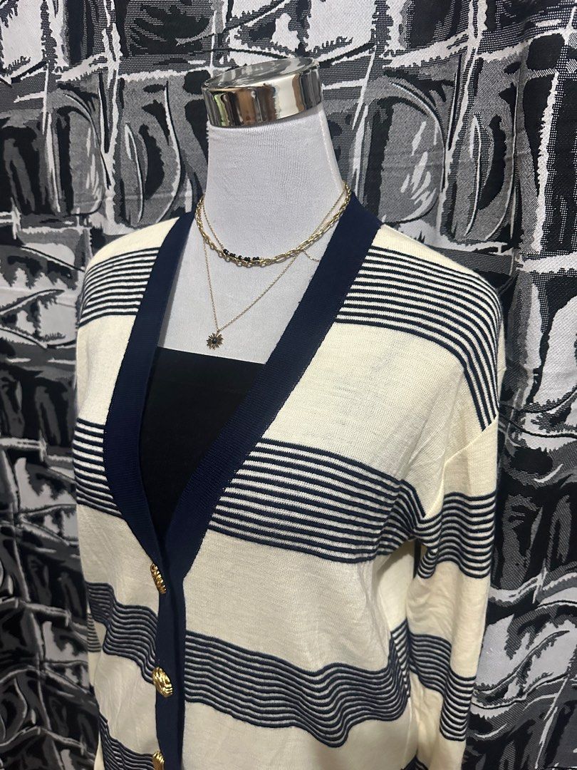 Striped Cardigan with Gold Buttons (Category: Coats, Jackets and Outerwear) located in Antipolo. Submitted by declutteringsizzy (Listing ID 1401160035, Image 3). Description: - Cream-colored cardigan - Navy blue stripes and trim - Gold buttons - Two front pockets - Long sleeves - V-neckline - Knit material - Size: Large to XL - Width = 23in” - Length = 31in”.