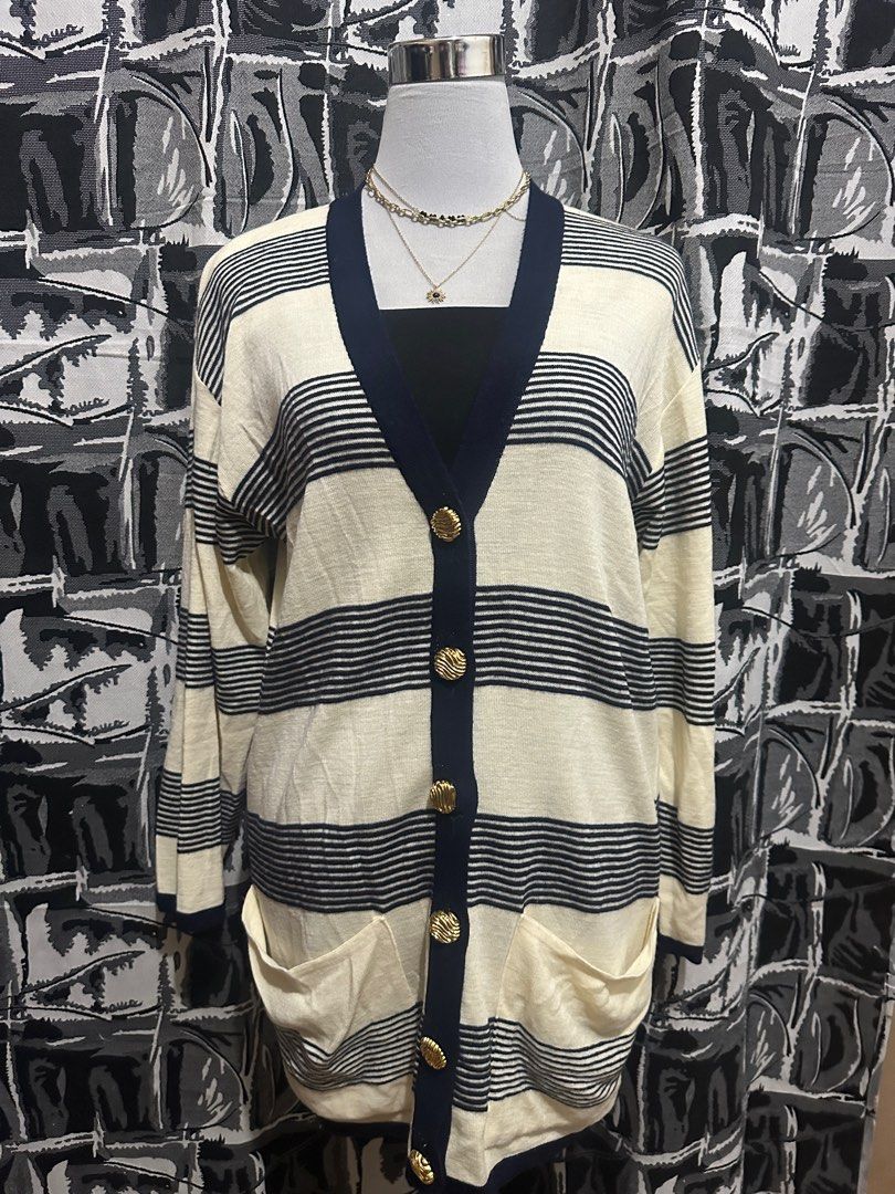 Striped Cardigan with Gold Buttons (Category: Coats, Jackets and Outerwear) located in Antipolo. Submitted by declutteringsizzy (Listing ID 1401160035, Image 2). Description: - Cream-colored cardigan - Navy blue stripes and trim - Gold buttons - Two front pockets - Long sleeves - V-neckline - Knit material - Size: Large to XL - Width = 23in” - Length = 31in”.