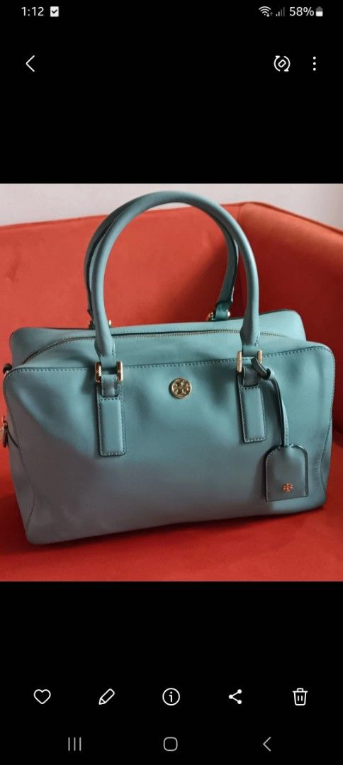Tory Burch Satchel Handbag (Category: Luxury Bags & Wallets) located in Las Pinas. Submitted by purselovebyisa (Listing ID 1401018457, Image 1). Description: - Tory Burch satchel handbag - Light blue color - Gold-tone hardware - Detachable tag included - Two top handles - Spacious main compartment - Tory Burch logo on front - Suitable for everyday or special use.