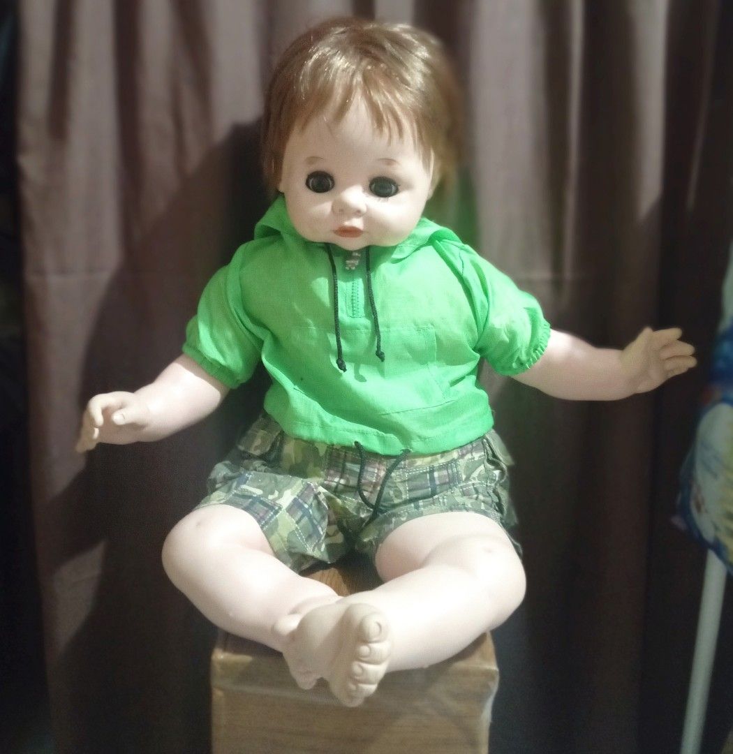 Vintage Japan baby Doll (Category: Kids Toys) located in Cainta. Submitted by ziannika28 (Listing ID 1401040409, Image 1). Description: - Vintage Takara lovely baby doll Japan - Brown hair and big eyes - Wearing a green hoodie and camouflage shorts (BAB outfit) - Sweet facial expression - Soft body material -Soft vinyl face,hands and feet - Neatly styled hair !Slightly negotiable!.