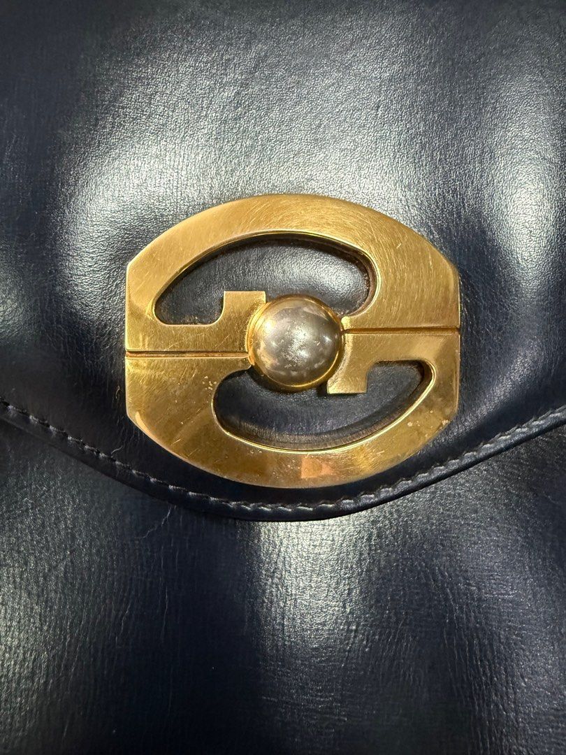 Vintage Interlocking Gucci -sale (Category: Luxury Bags & Wallets) located in Rizal. Submitted by xsbaggage_ (Listing ID 1400971897, Image 3). Description: Vintage Gucci Interlocking shoulder bag Sling is adjustable, color is dark blue Good condition for a vintage gucci Lock is tight , takes a little more effort to open, Very nice in actual Size: 9 inches w x 7 h x 2 .