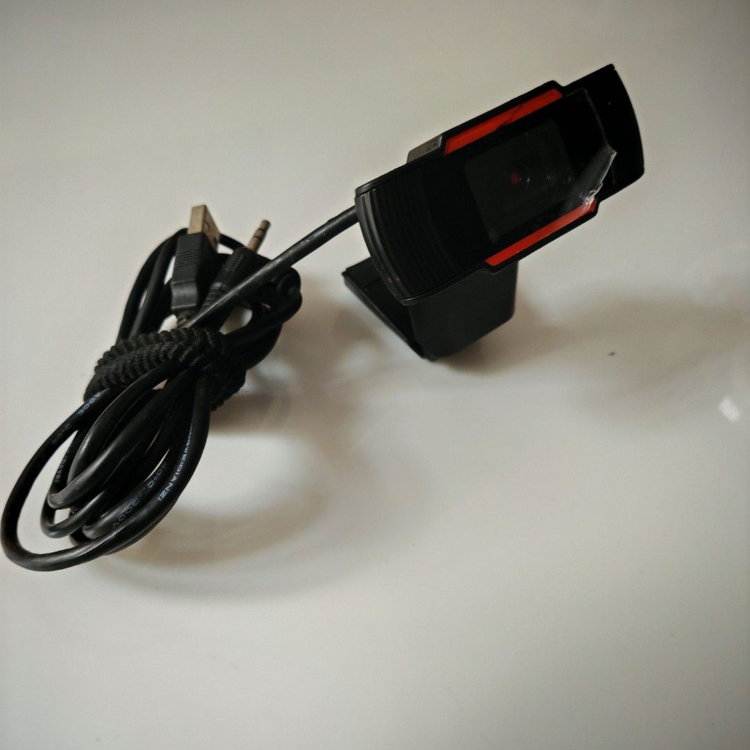 Webcam with USB Cable (Category: Webcams) located in Caloocan City. Submitted by det123123 (Listing ID 1401016507, Image 1). Description: - Black webcam with red accent - USB cable included - Built-in clip for easy mounting - Perfect for video calls, online meetings, and streaming - In good working condition.