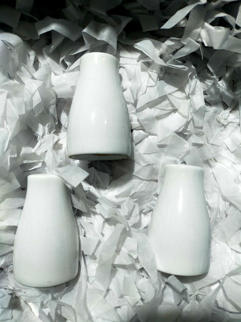 White Ceramic Salt and Pepper Shakers (Category: Other Kitchenware & Tableware) located in Quezon City. Submitted by mcmp1216 (Listing ID 1401000976, Image 1). Description: - Very good conditions well kept - White ceramic salt and pepper shakers - Classic, minimalist design - Salt shaker with multiple holes - Shakers with single hole rubber lids at the bottom.