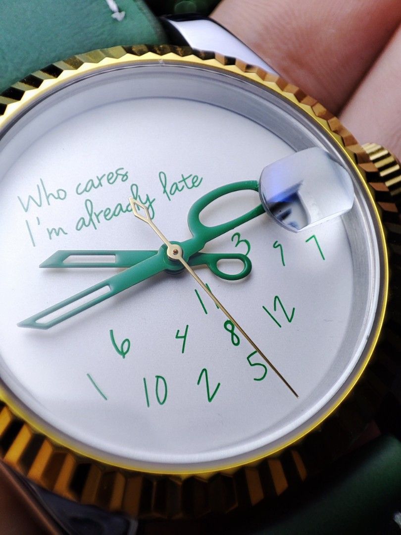 Who Cares I'm Already Late Watch (Category: Men's Watches) located in Quezon City. Submitted by NiceWatchPare (Listing ID 1401040903, Image 3). Description: 💚 Fun take on "Who Cares I'm Late" Perfect for daily office beater watch with a sense of humor ✂️ ⌚ Custom Watch Specs: -36mm S/S case with gold fluted bezel -White dial with green printing -Green scissor handset and gold seconds -Green leather strap with S/S buckle -Date complication with c