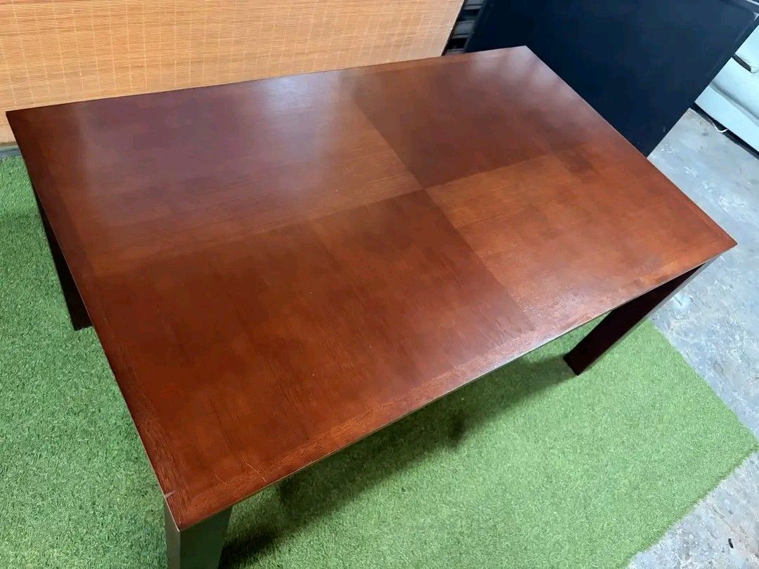 Wooden Dining Table (Category: Tables & Sets) located in Manila. Submitted by eloizavill76462 (Listing ID 1401047500, Image 3). Description: - Solid wood dining table - Dark brown finish - Rectangular tabletop - Supported by four square legs - Suitable for dining or workspace - Simple and elegant design.