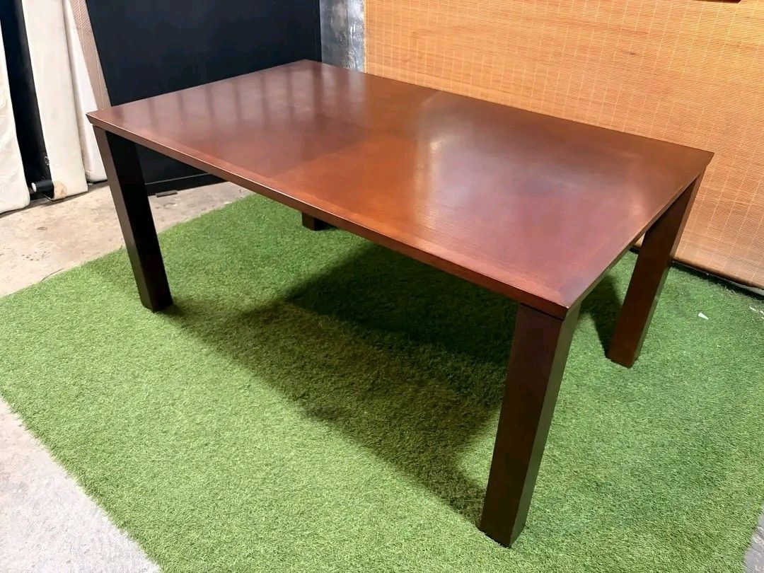 Wooden Dining Table (Category: Tables & Sets) located in Manila. Submitted by eloizavill76462 (Listing ID 1401047500, Image 2). Description: - Solid wood dining table - Dark brown finish - Rectangular tabletop - Supported by four square legs - Suitable for dining or workspace - Simple and elegant design.