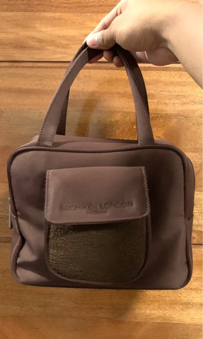 Y2k Michiko London Choco Brown Bag (Category: Purses & Pouches) located in Laoag. Submitted by hotstuffben (Listing ID 1401152879, Image 1). Description: -Used only once -Zipper shows signs of usage but still fully functional. -Mop:Gcash Only Mod:J&T Only.