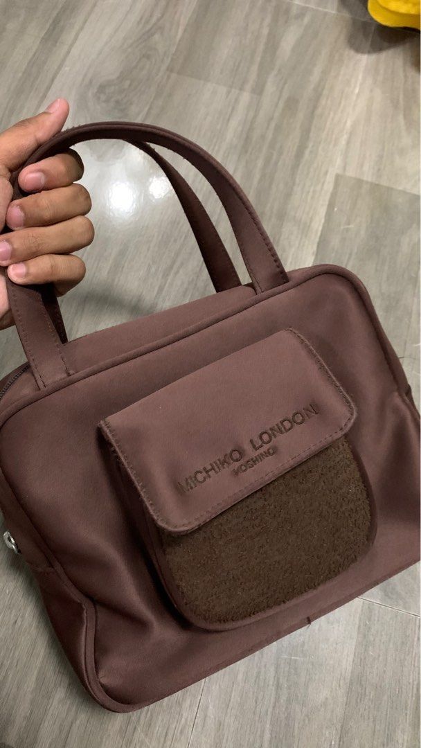 Y2k Michiko London Choco Brown Bag (Category: Purses & Pouches) located in Laoag. Submitted by hotstuffben (Listing ID 1401152879, Image 2). Description: -Used only once -Zipper shows signs of usage but still fully functional. -Mop:Gcash Only Mod:J&T Only.