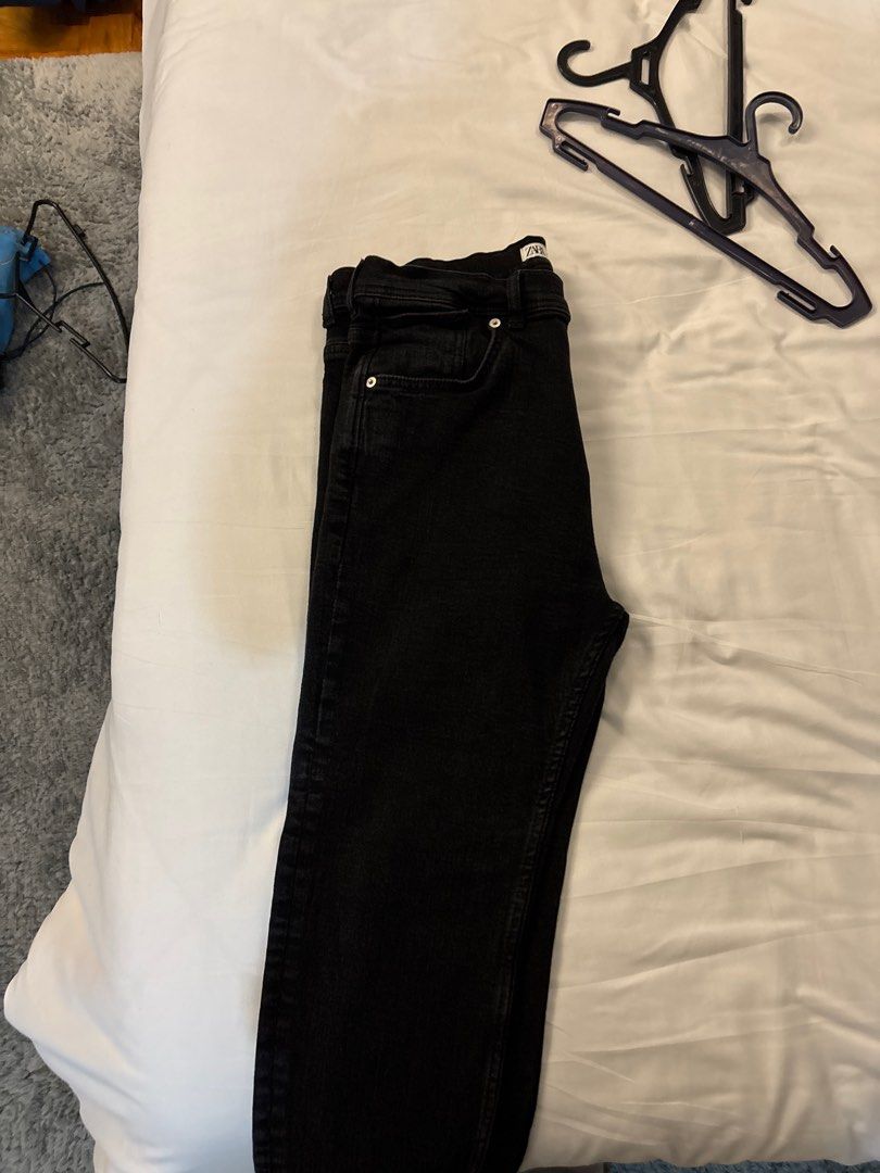 Zara Black Jeans (Category: Joggers) located in Manila. Submitted by junjun_jomar (Listing ID 1401108787, Image 3). Description: Black jeans from Zara. Features a button and zipper closure. Has two front pockets and two back pockets. The jeans appear to be a straight-leg fit. The fabric looks to be a medium-weight denim. The jeans are a solid black color..