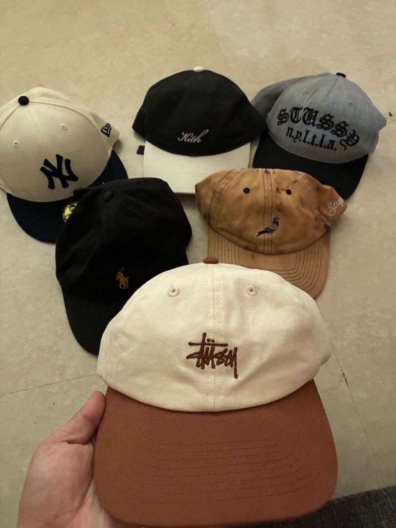 Assorted Caps - Stussy, Kith, Polo, New Era (Category: Caps & Hats) located in Caloocan City. Submitted by kendrickkiff2023 (Listing ID 1396130734, Image 1). Description: - Assorted cap collection. - Brands include: Stussy, Kith, Polo, New Era Yankees. - Features a Stussy cap with brown brim, Stussy n.p.i.t.l.a. cap, and a bird-embroidered cap..